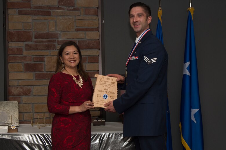 Senior Airman Daulton Charles, Airman Leadership School graduate, accepts the academic award during the graduation of ALS class 20-2, February 13, 2020, on Holloman Air Force Base, N.M. The academic award is presented to the student with the highest overall average on all academic evaluations. (U.S. Air Force photo by Airman 1st Class Kristin Weathersby)