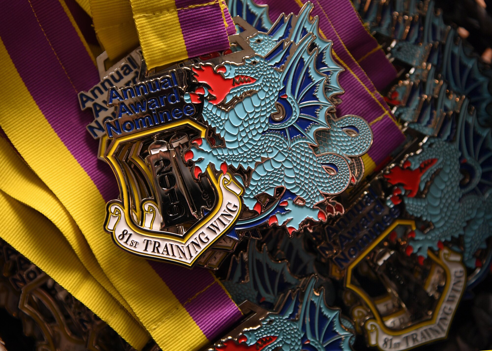 Medallions are displayed during the 81st Training Wing's 2019 Annual Awards Ceremony inside the Bay Breeze Event Center at Keesler Air Force Base, Mississippi, Feb. 14, 2020. During the ceremony, base leadership recognized outstanding Airmen and civilians from across the installation for their accomplishments throughout 2019. (U.S. Air Force photo by Kemberly Groue)