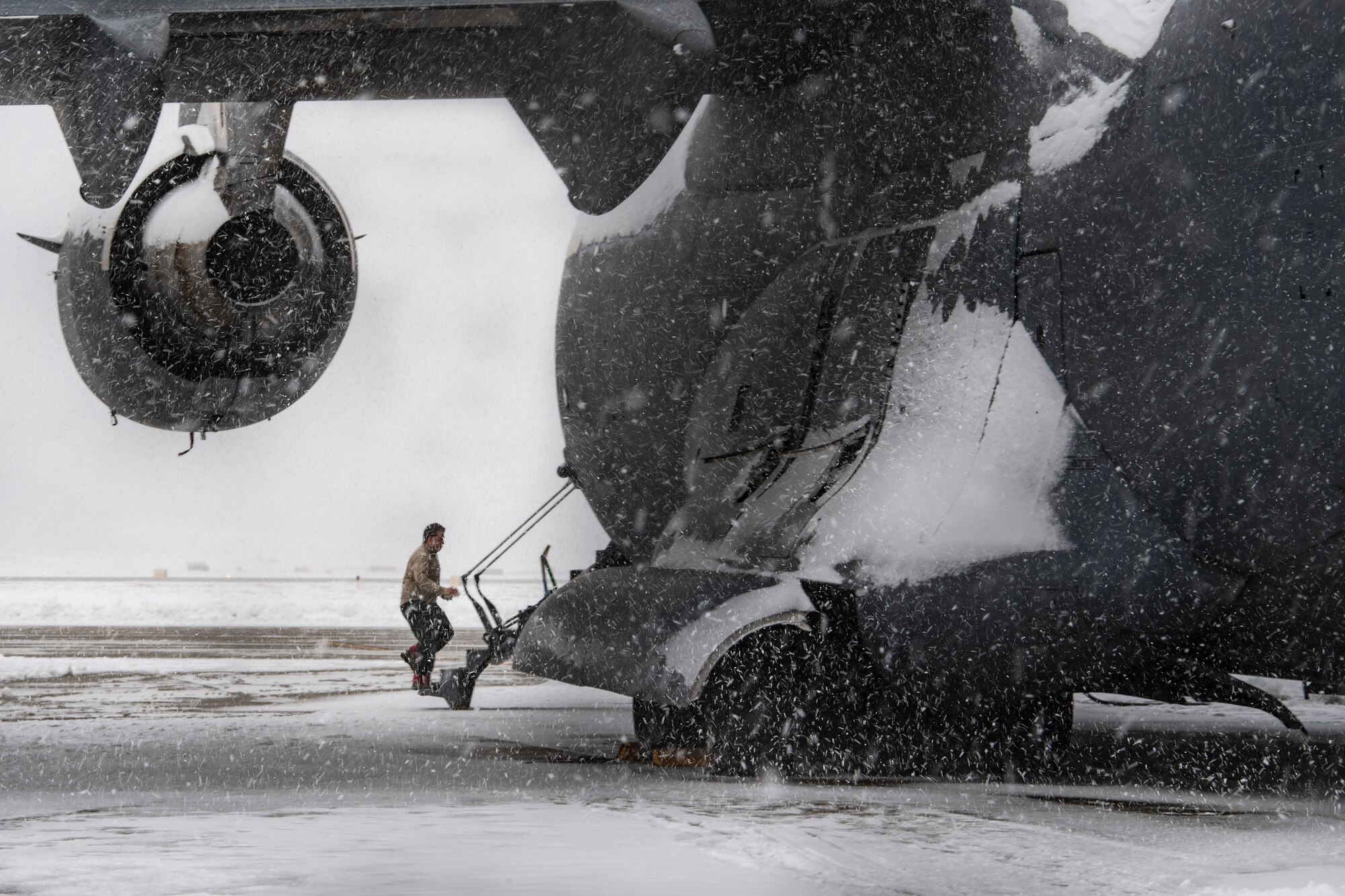 Airman 1st Class enters a C-17 Globemaster III