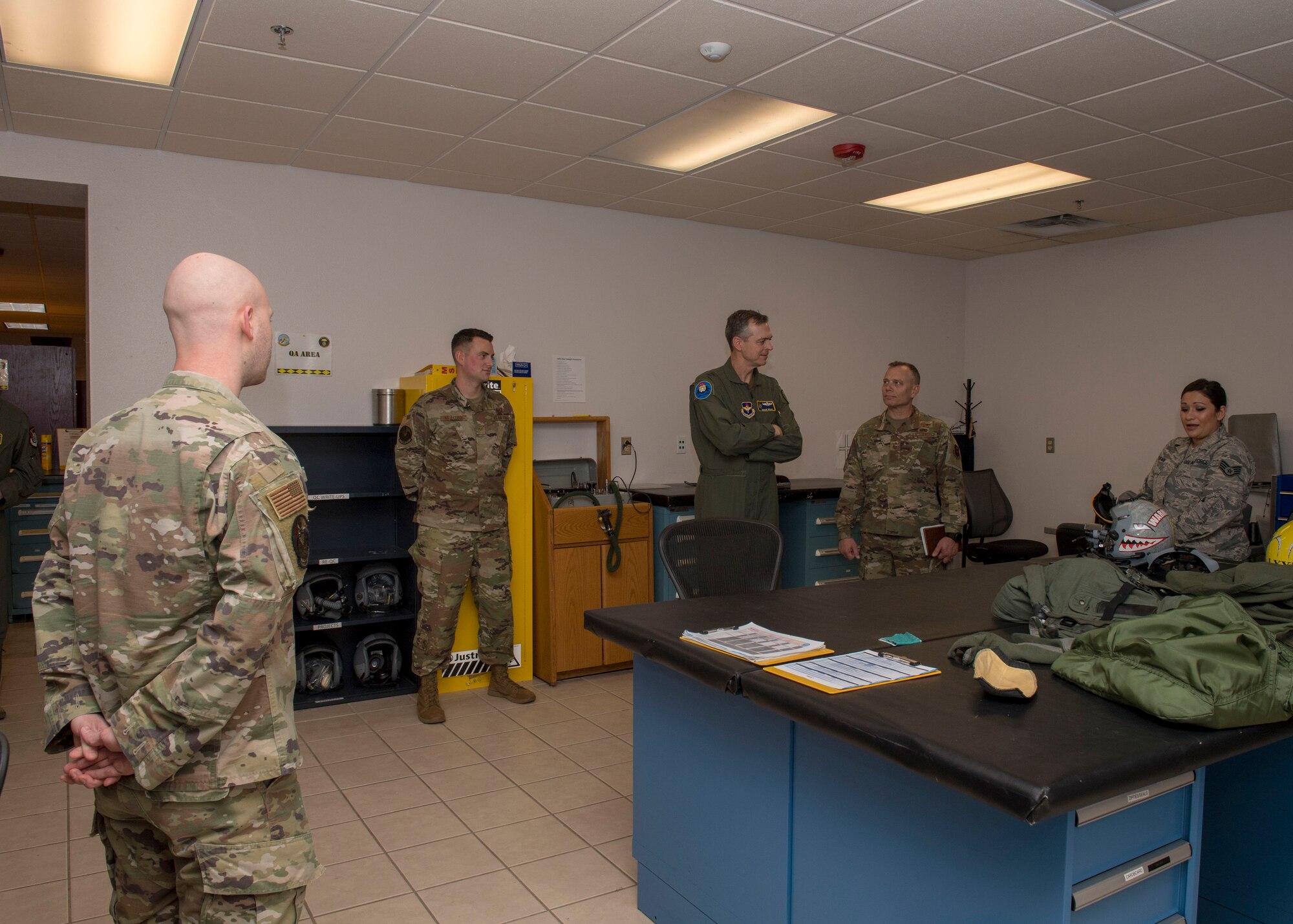 Airmen with the 314th Attack Squadron aircrew flight equipment shop speak with the 19th Air Force command team, Feb. 13, 2020, on Holloman Air Force Base, N.M. The 19th AF command team toured 49th Wing facilities, focusing on recognizing Airmen making a positive impact on the mission. (U.S. Air Force photo by Airman 1st Class Autumn Vogt)