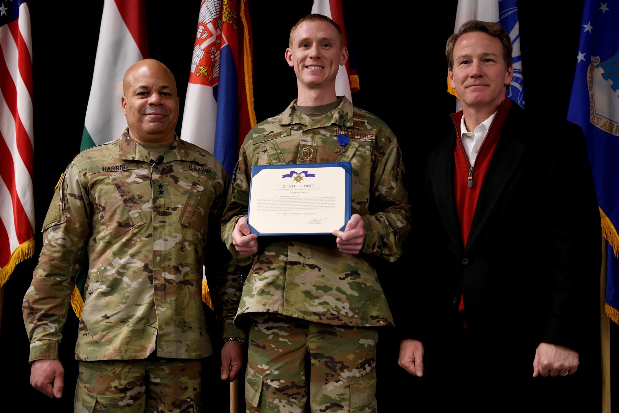 U.S. Army Maj. General John C. Harris, the Ohio Adjutant General, U.S. Air Force Master Sgt. Ryan Tucker, and Ohio’s Lt. Governor Jon Husted pose for a portrait after Husted awarded the Ohio Cross to Tucker during the Ohio National Guard’s Joint Senior Leaders Conference Feb. 14, 2020 in Columbus, Ohio. The Ohio Cross is awarded to any member of the state military forces who distinguishes themselves by gallantry and intrepidity at the risk of their life. (U.S. Air Force photo by Tech. Sgt. Shane Hughes)