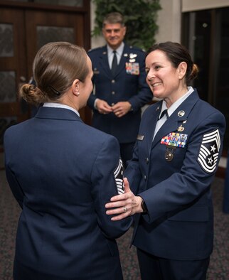 Chief Master Sgt. Barbara Gilmore, 932nd Airlift Wing Command, congratulates Senior Master Sgt. Tabitha Knupp on her selection as an Annual Award nominee in the First Sergeant category during the pre Awards Banquet ceremony, Feb. 8, 2020, Scott Air Force Base, Illinois.  Col. Glenn Collins, commander, 932nd AW, joined Gilmore during the ceremony and presented each nominee with a Wing coin. (U.S. Air Force photo by Christopher Parr)