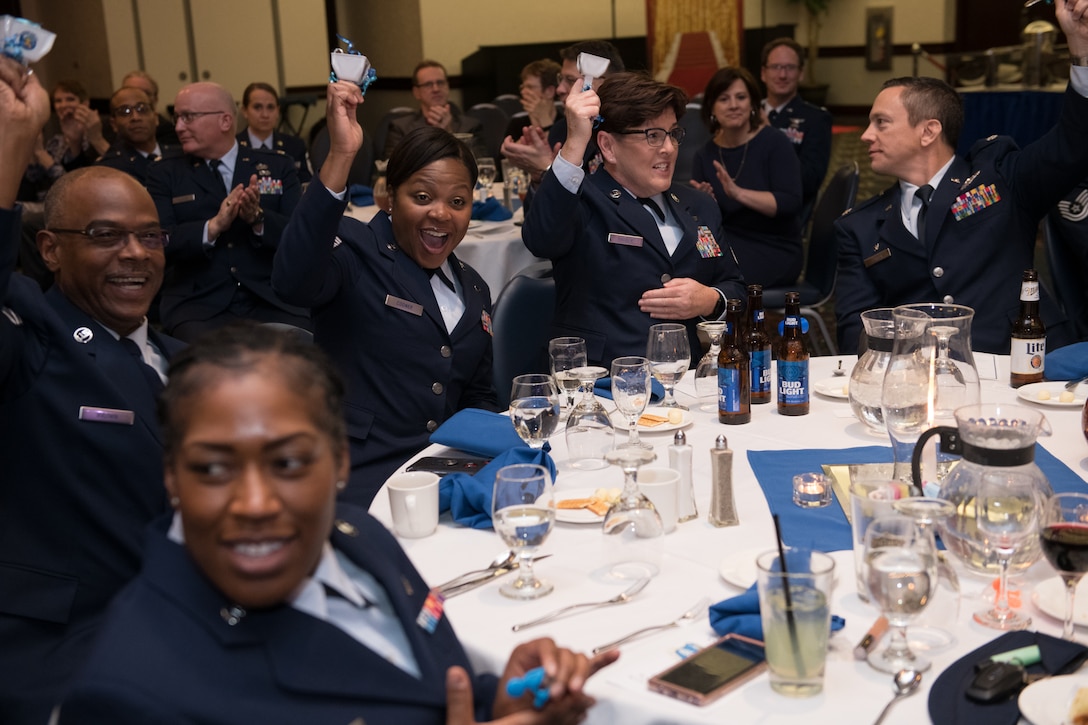 Attendees at the 3rd Annual Awards Banquet honoring Citizen Airmen from the 932nd Airlift Wing and 954th Reserve Support Squadron cheer in celebration of an announced winner in the Airmen category. (U.S. Air Force photo by Christopher Parr)