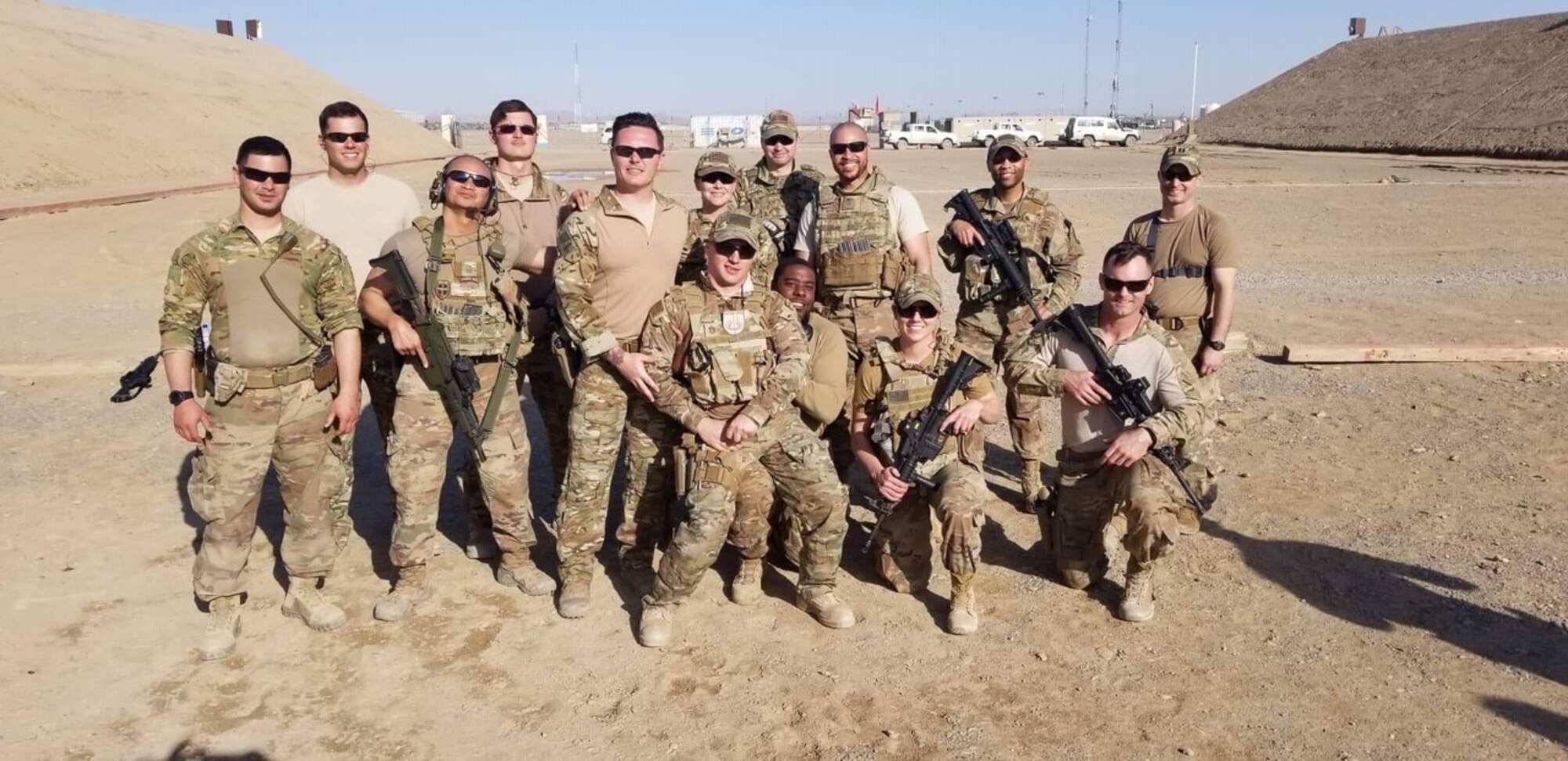 Capt. Shane Lockridge (front row kneeling first from the left) poses with his members of his team assigned to the 738th Air Expeditionary Advisory Group in Kandahar, Afghanistan.