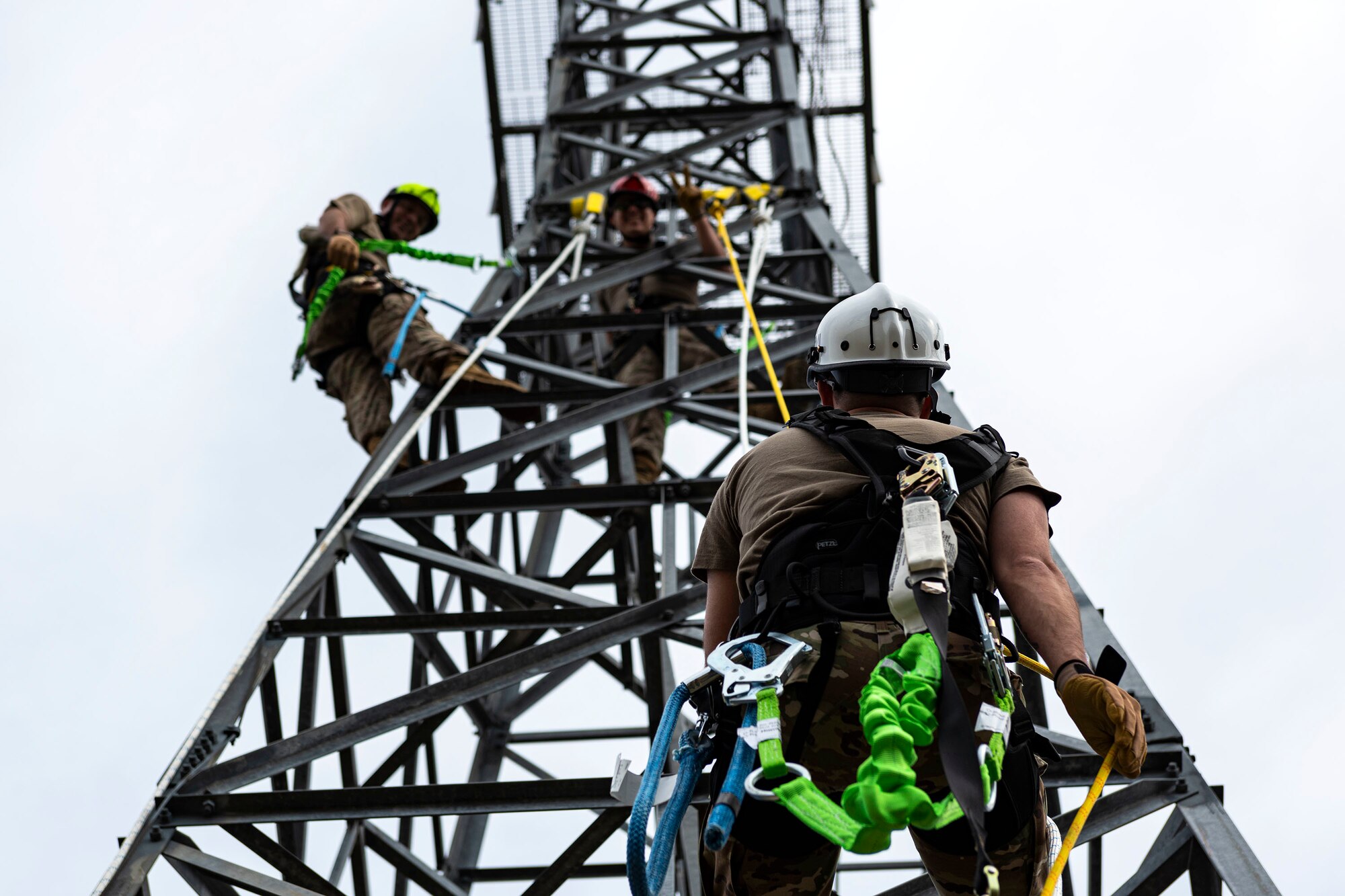 Airfield and weather systems journeyman, and apprentice rappel down a radio antenna tower
