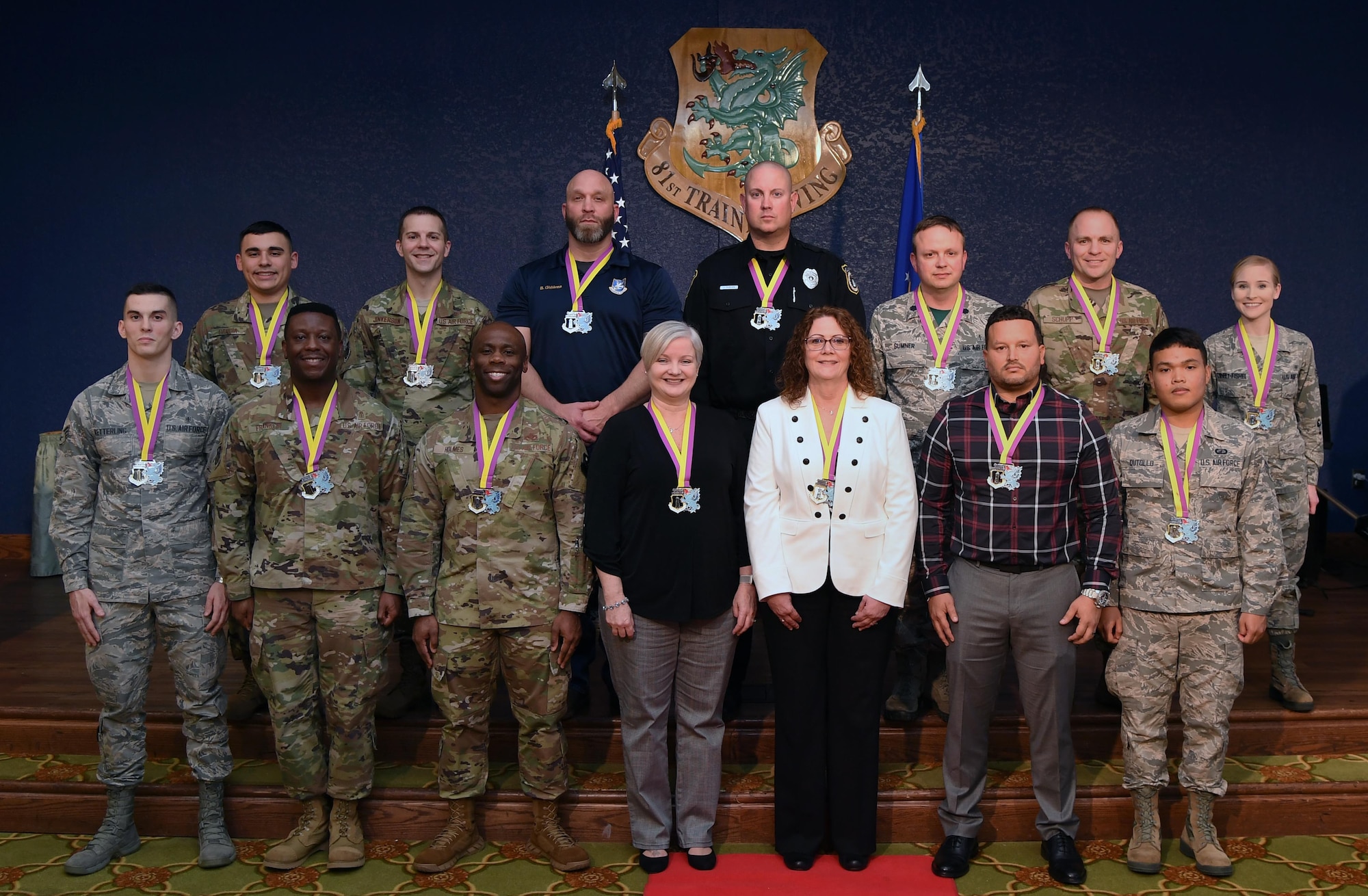 Winners of the 81st Training Wing's 2019 Annual Awards Ceremony pose for a photo inside the Bay Breeze Event Center at Keesler Air Force Base, Mississippi, Feb. 14, 2020. During the ceremony, base leadership recognized outstanding Airmen and civilians from across the installation for their accomplishments throughout 2019. (U.S. Air Force photo by Kemberly Groue)