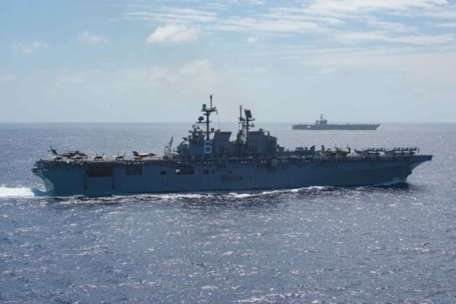 PACIFIC OCEAN (Feb. 15, 2020) The amphibious assault ship USS America (LHA 6) and the aircraft carrier USS Theodore Roosevelt (CVN 71) transit the Pacific Ocean Feb. 15, 2020. Operating as an Expeditionary Strike Force, the Navy-Marine Corps team integrates carrier strike group combat power with the flexible capability of an expeditionary strike group to provide the fleet commander with a capable, credible combat force that can be deployed anywhere in the world.