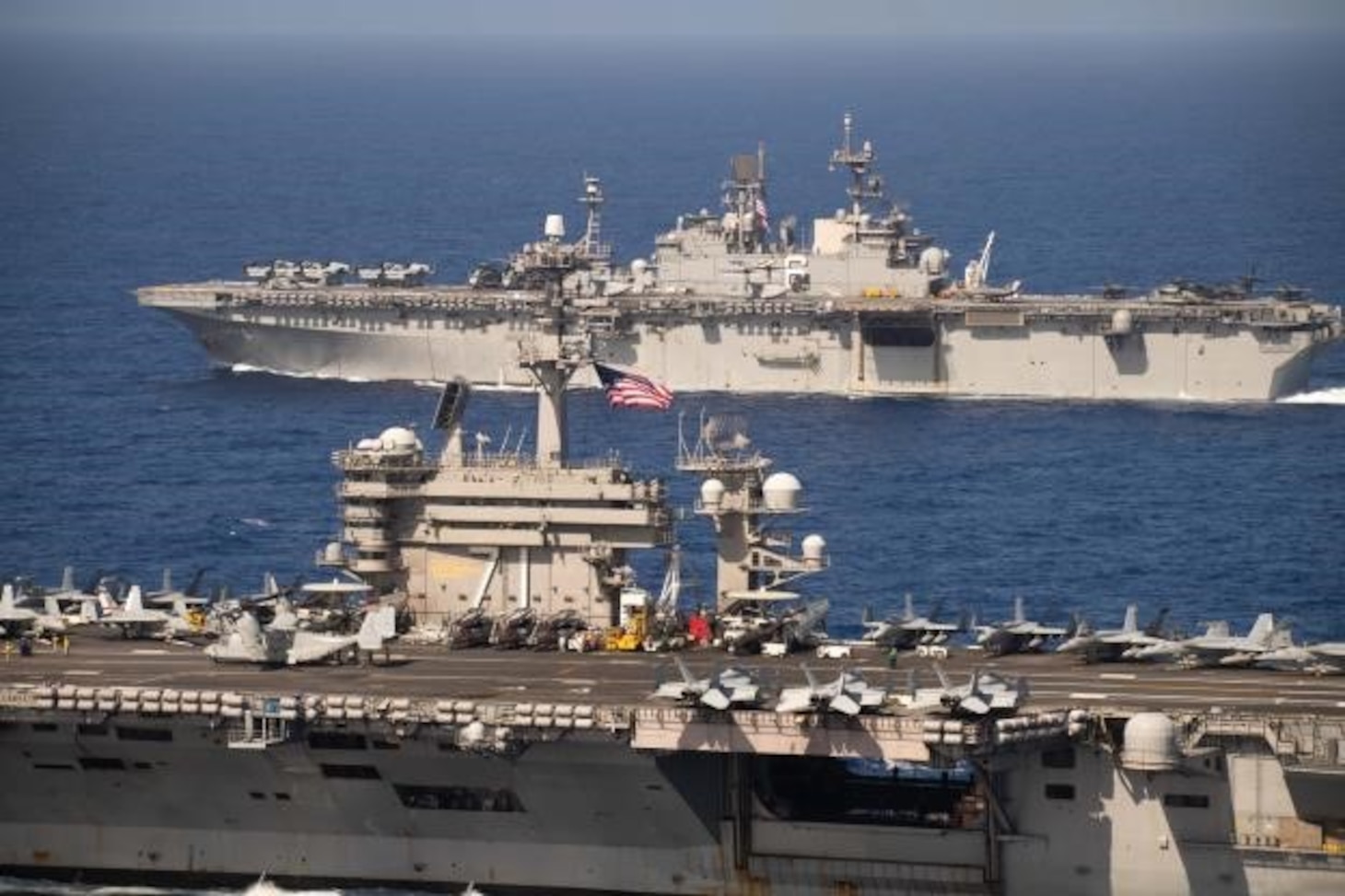 PACIFIC OCEAN (Feb. 15, 2020) The aircraft carrier USS Theodore Roosevelt (CVN 71) and the amphibious assault ship USS America (LHA 6) transit the Pacific Ocean Feb. 15, 2020. Operating as an Expeditionary Strike Force, the Navy-Marine Corps team integrates carrier strike group combat power with the flexible capability of an expeditionary strike group to provide the fleet commander with a capable, credible combat force that can be deployed anywhere in the world.