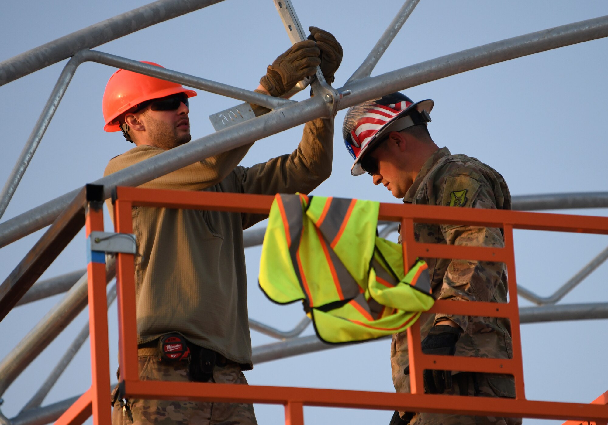 Photo of Airmen constructing an outdoor gym.