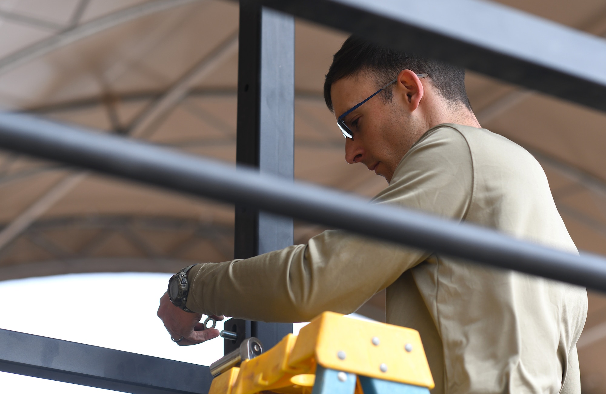 Photo of Airmen constructing an outdoor gym.