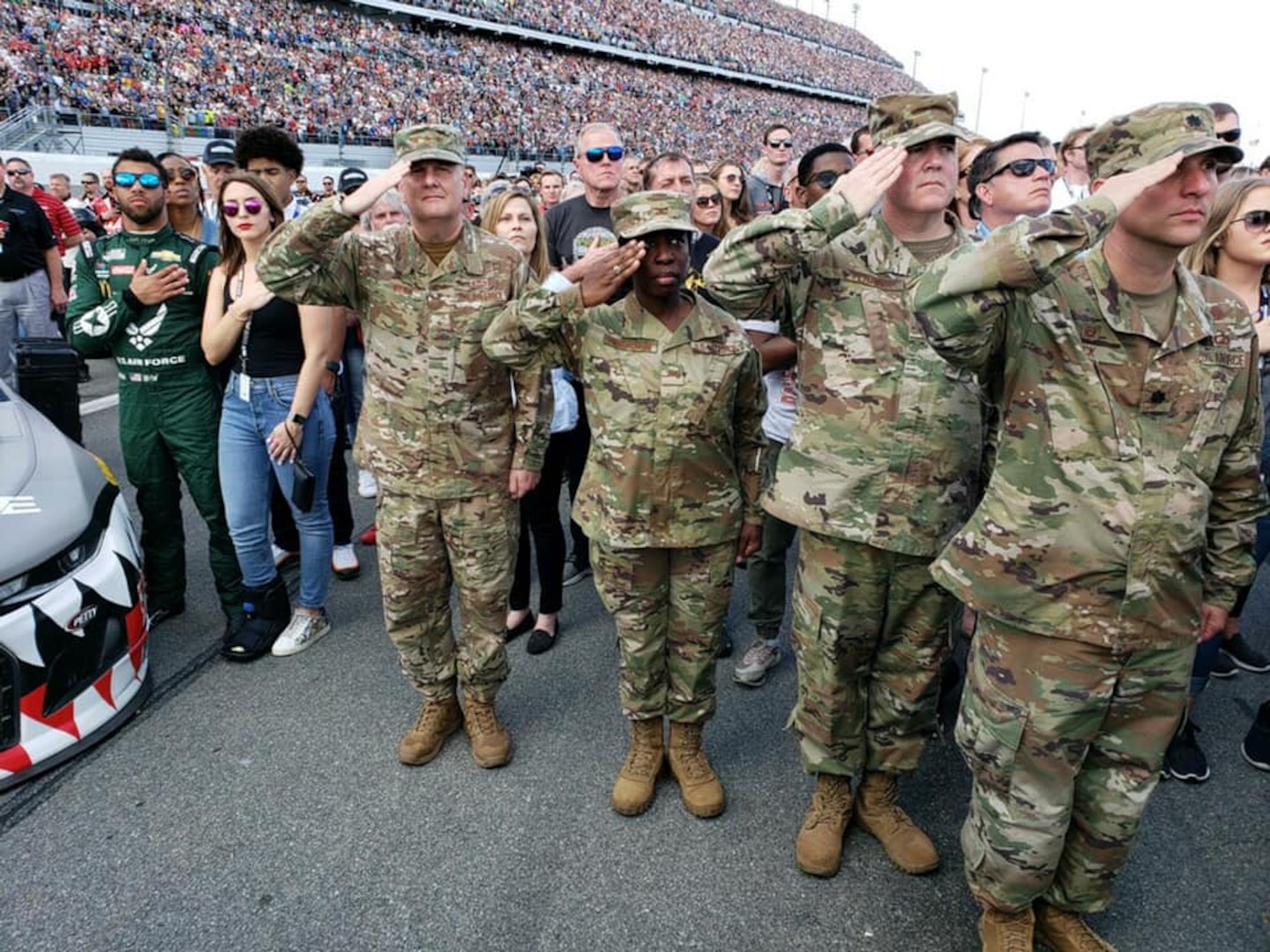 Military personnel saluting.
