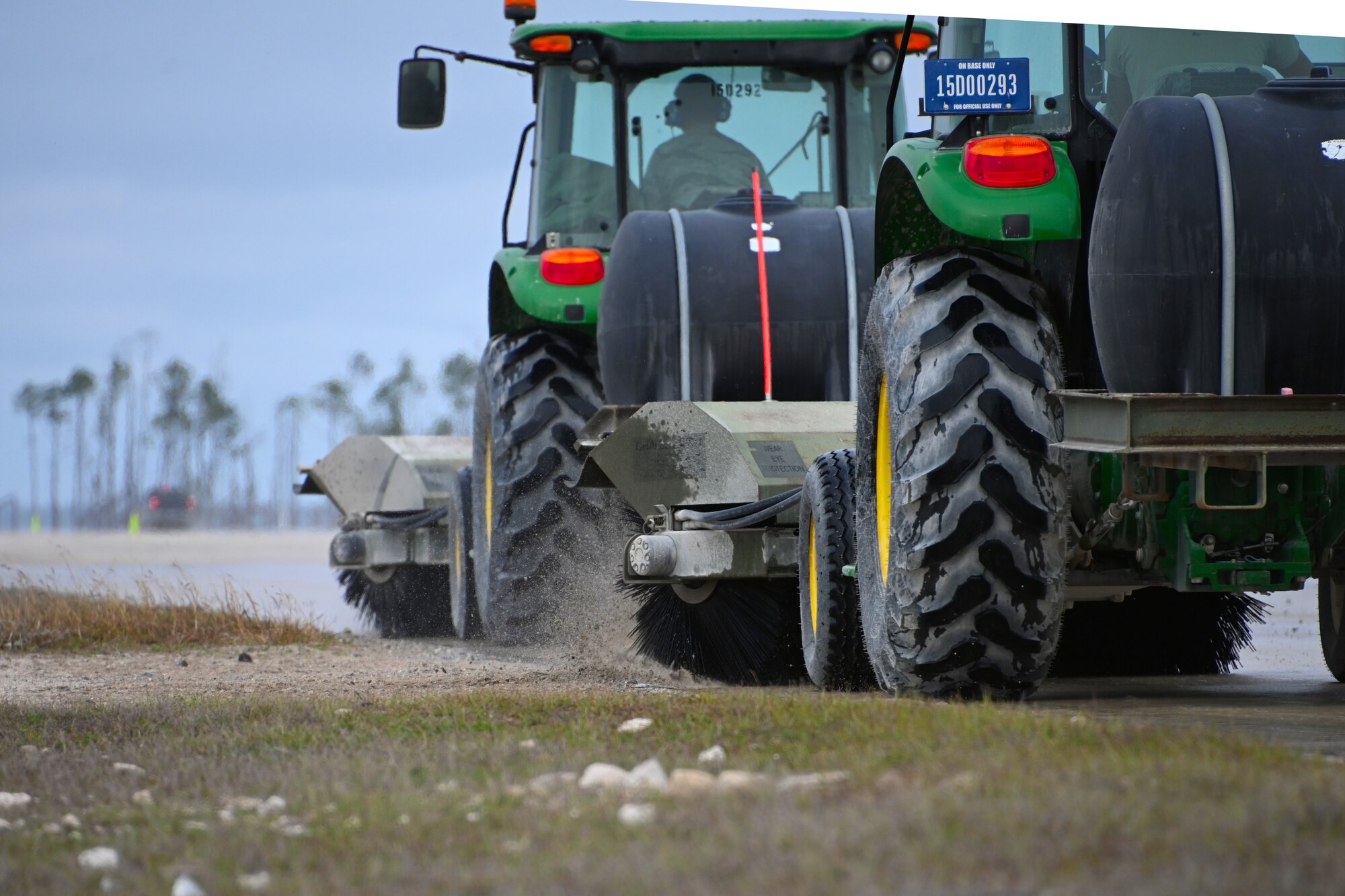 Photo of tractors cleaning runway