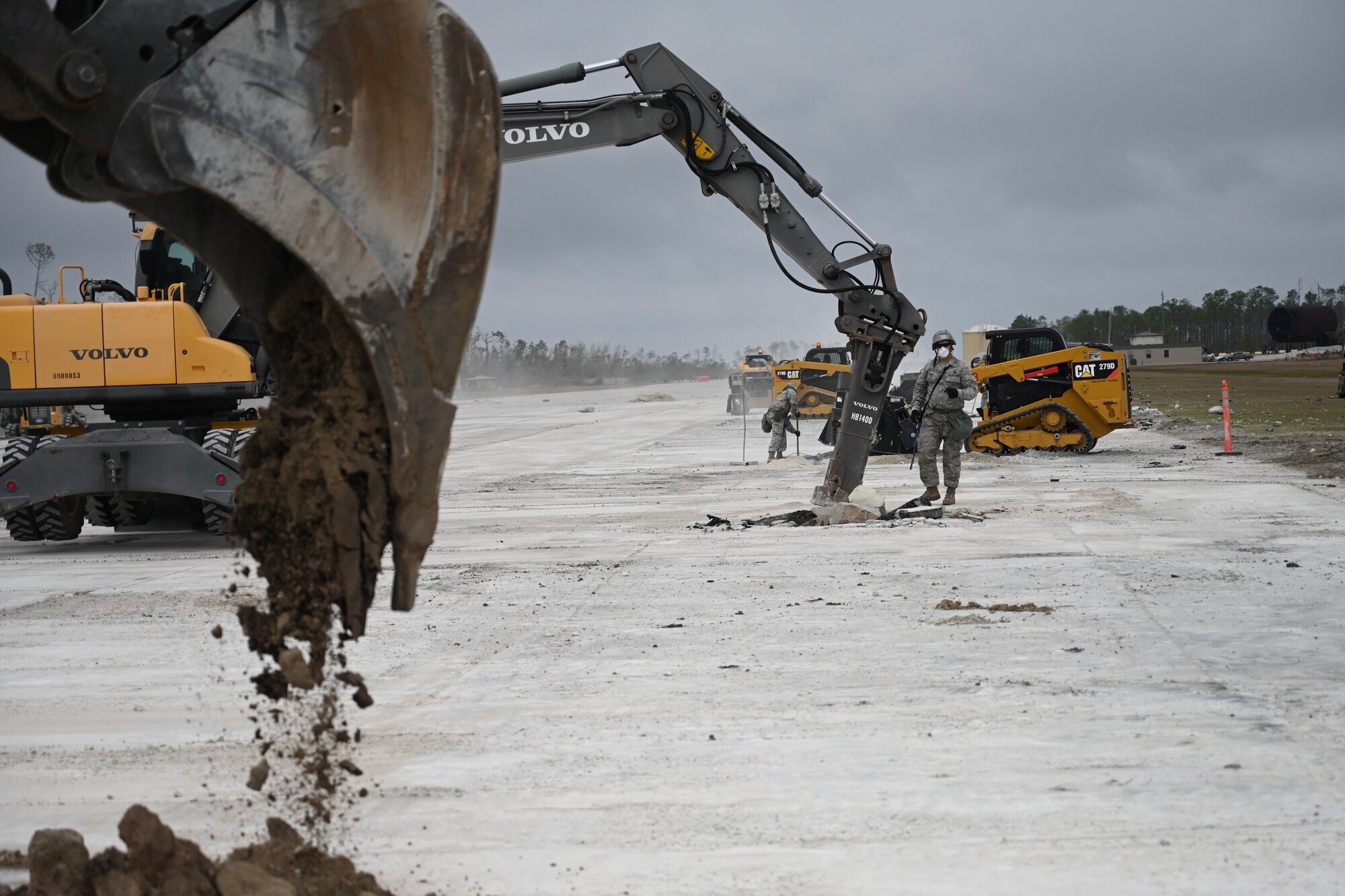 Photo of heavy equipment working on runway.