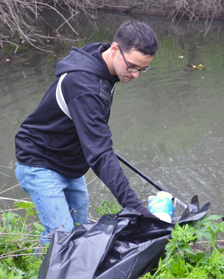 Airman picks up trash