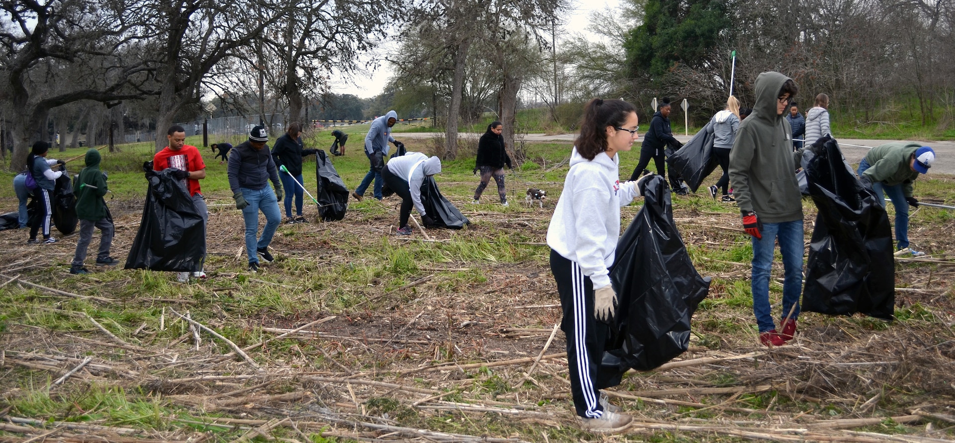 Volunteers pick up trash and debris