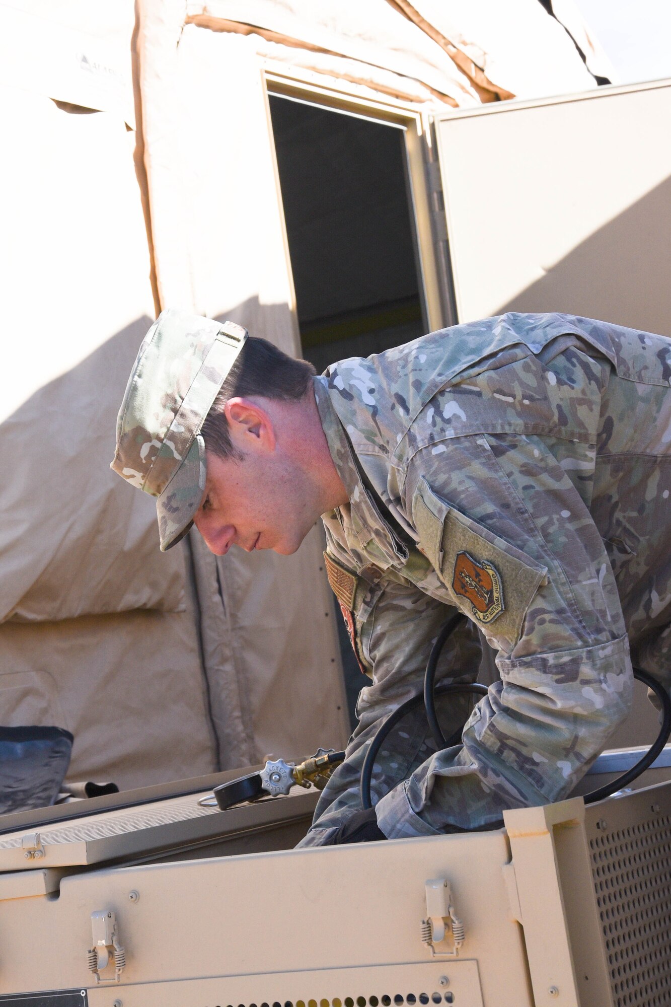 On the ground at Nellis Air Force Base, Nevada, Battle Manager Crews from the 729th Air Control Squadron working in a Control and Reporting Center are engaged in directing the Airspace for Red Flag 20-1; More than 100 miles away, members of the same unit built a deployed radar site in the middle of the desert to supplement the Command and Control systems used to direct the airspace of RED FLAG 20-1 (U.S. Air Force photo by 2d Lt. Ashlyn K. Paulson).