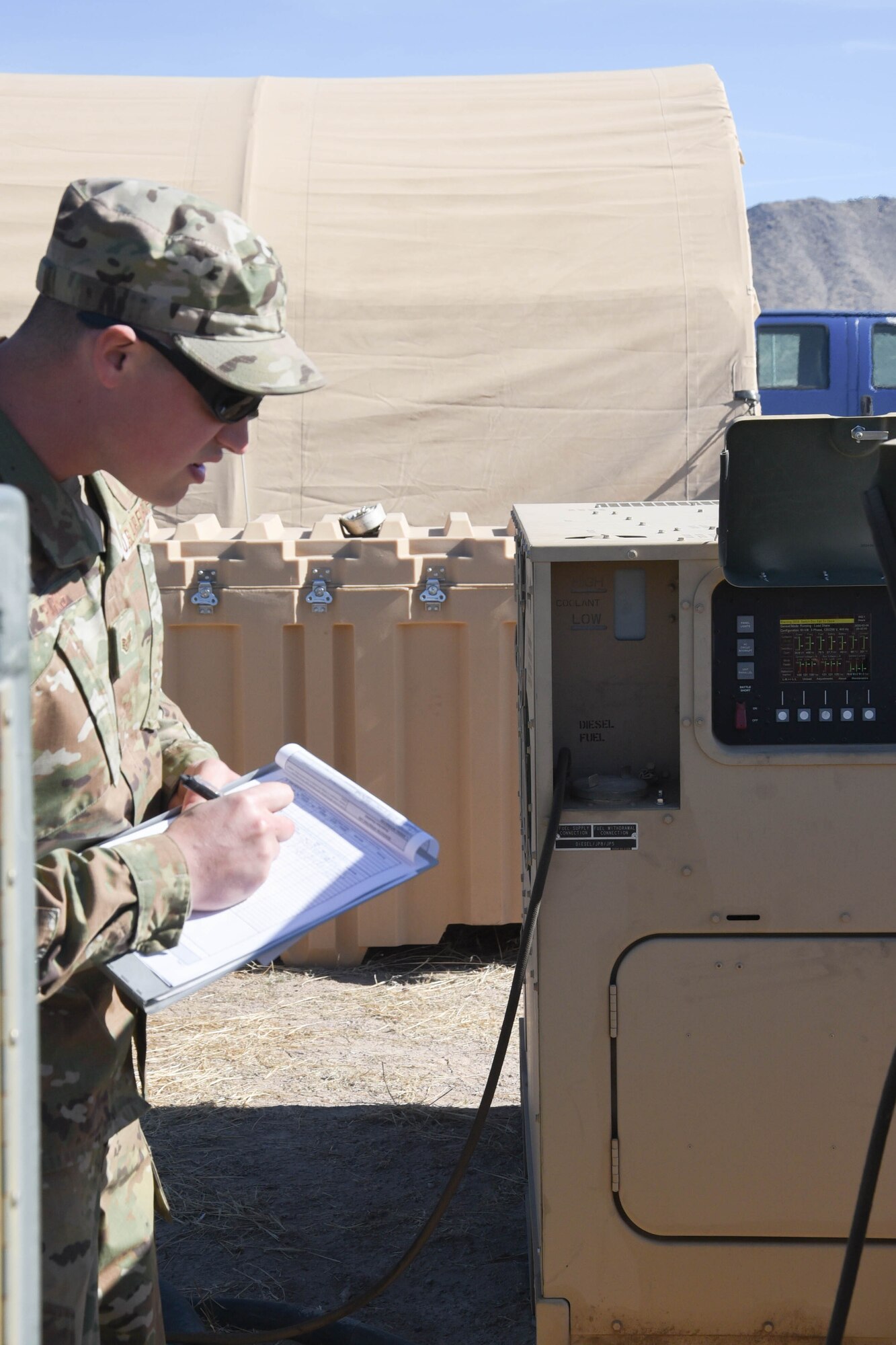 On the ground at Nellis Air Force Base, Nevada, Battle Manager Crews from the 729th Air Control Squadron working in a Control and Reporting Center are engaged in directing the Airspace for Red Flag 20-1; More than 100 miles away, members of the same unit built a deployed radar site in the middle of the desert to supplement the Command and Control systems used to direct the airspace of RED FLAG 20-1 (U.S. Air Force photo by 2d Lt. Ashlyn K. Paulson).