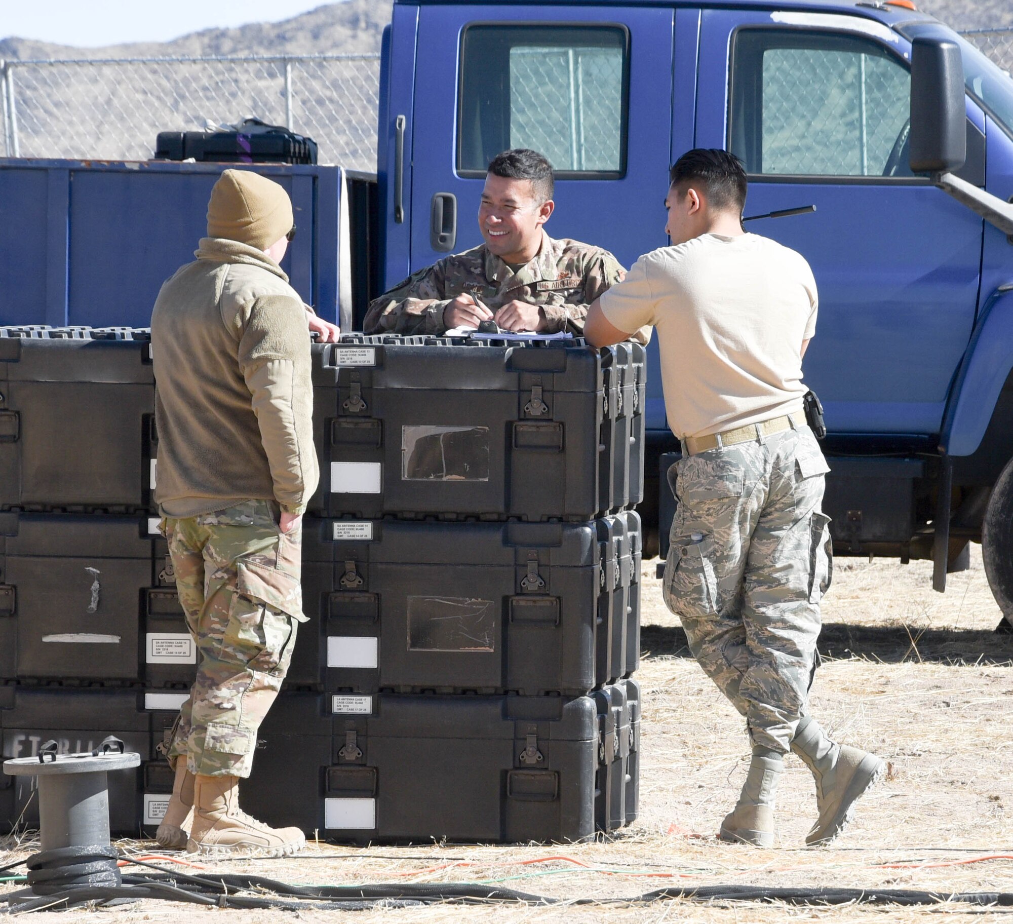 On the ground at Nellis Air Force Base, Nevada, Battle Manager Crews from the 729th Air Control Squadron working in a Control and Reporting Center are engaged in directing the Airspace for Red Flag 20-1; More than 100 miles away, members of the same unit built a deployed radar site in the middle of the desert to supplement the Command and Control systems used to direct the airspace of RED FLAG 20-1 (U.S. Air Force photo by 2d Lt. Ashlyn K. Paulson).