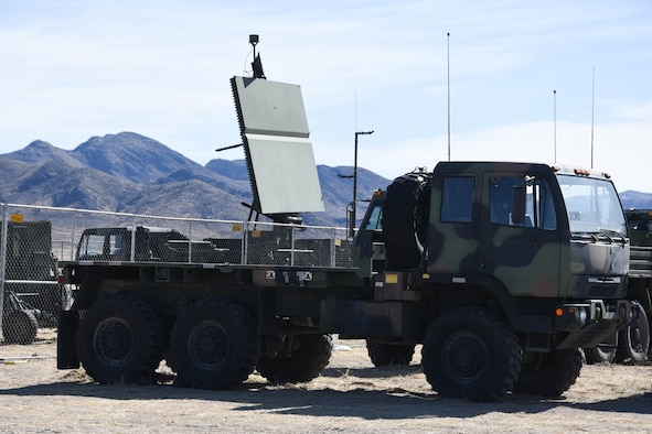 On the ground at Nellis Air Force Base, Nevada, Battle Manager Crews from the 729th Air Control Squadron working in a Control and Reporting Center are engaged in directing the Airspace for Red Flag 20-1; More than 100 miles away, members of the same unit built a deployed radar site in the middle of the desert to supplement the Command and Control systems used to direct the airspace of RED FLAG 20-1 (U.S. Air Force photo by 2d Lt. Ashlyn K. Paulson).
