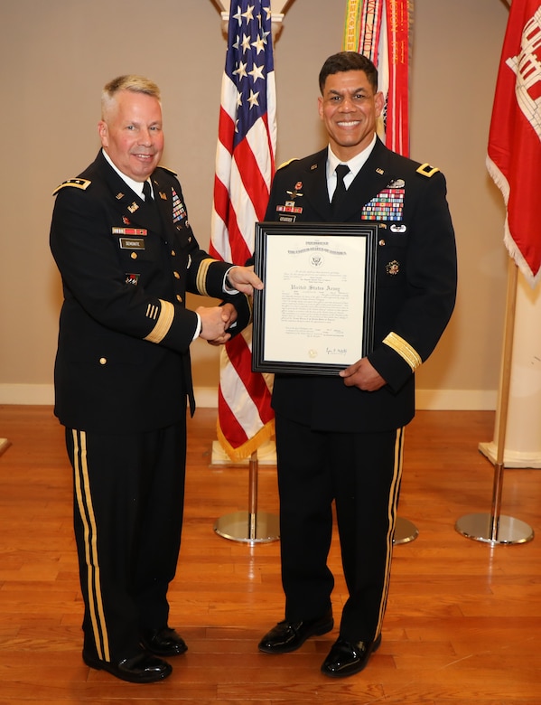 Lt. Gen. Todd T. Semonite, USACE Commanding General and 54th U.S. Army Chief of Engineers presents Brig. Gen. Mark Quander with a certificate of promotion. Quander, the commandant of the U.S. Army Engineer School, was promoted to the rank of Brigadier General at Fort Myer, Virginia on Feb. 14, 2020.