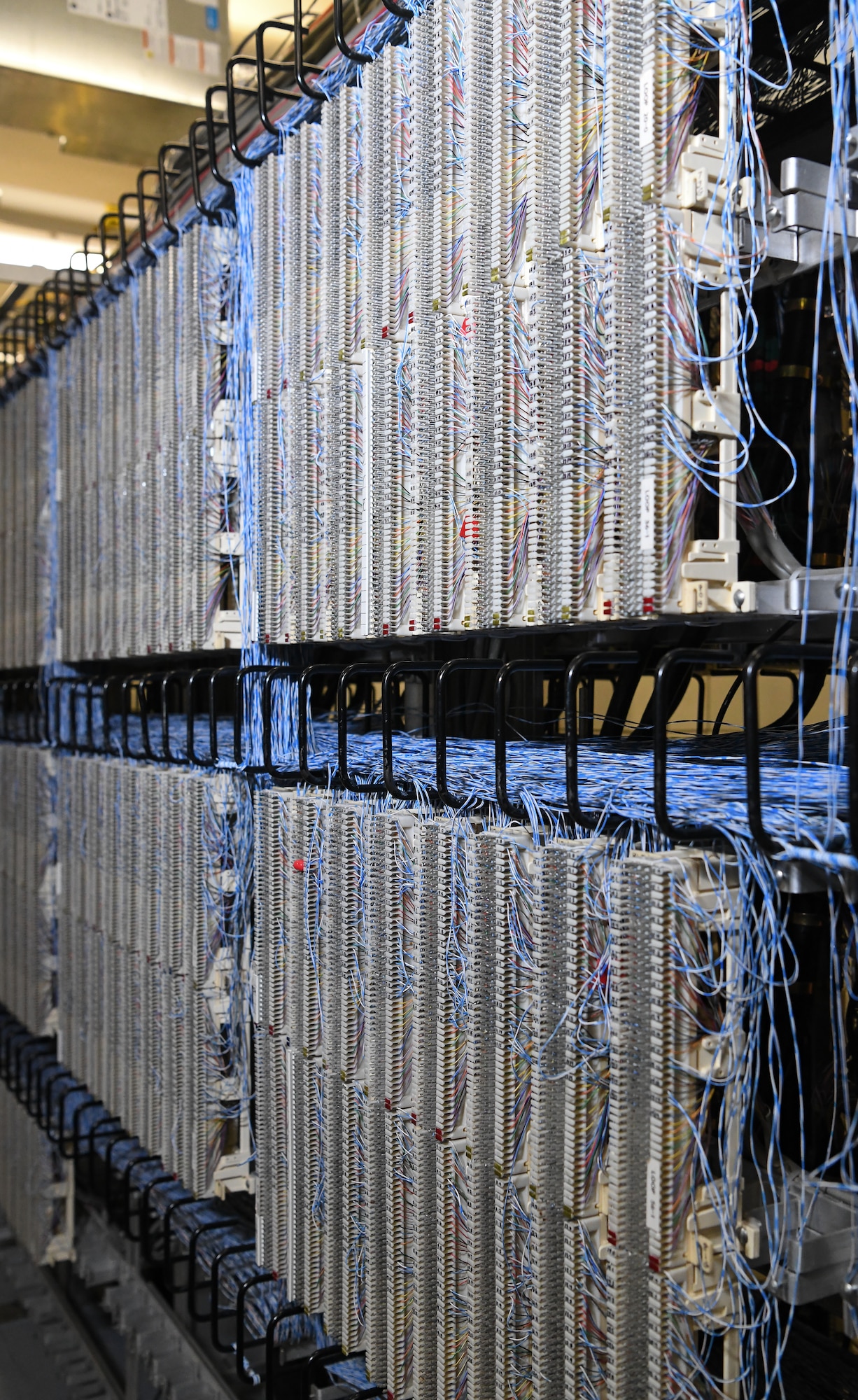 The main distribution frame of punch-down blocks, seen here Dec. 12, 2019, houses the connections of telephone lines at Arnold Air Force Base, Tenn. in the Telephone Switchroom. (U.S. Air Force photo by Jill Pickett)