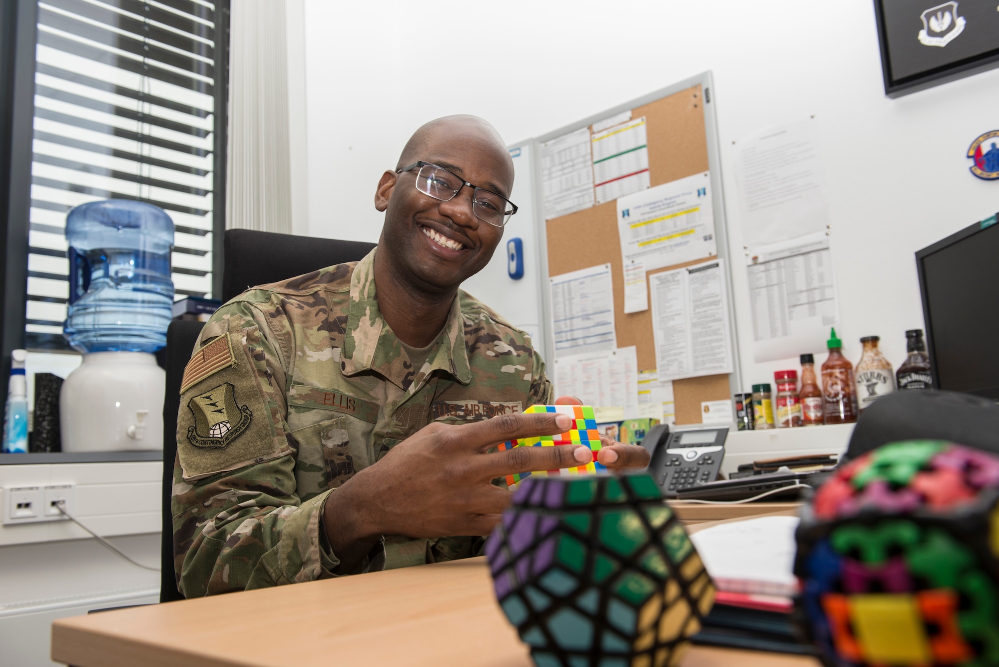 Photo of first sergeant sitting at his desk