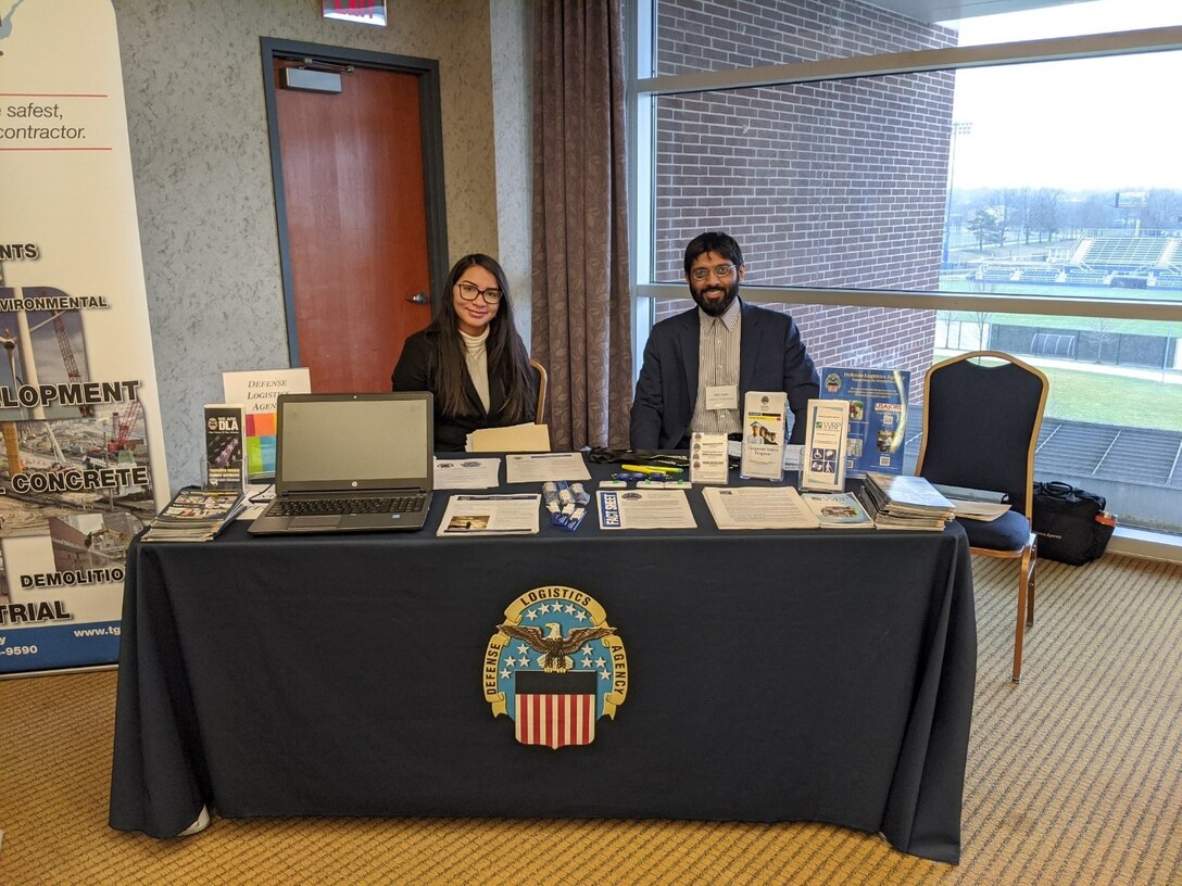 Picture of DLA Land & Maritime Recruitment Booth with recruiters Brenda Lopez-Rivera and Adil Zuber