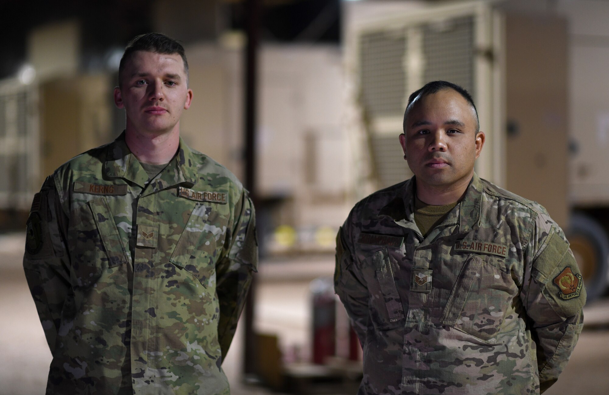 Photo of Airmen performing preventative maintenance on a generator.