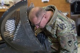 Staff Sgt. Patrick McDonald, avionic mechanic, 1107th Theater Aviation Sustainment Maintenance Group, works to repair an anti-collision light for a UH-60 helicopter at Camp Buehring, Kuwait, Feb. 11, 2020.