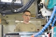 Staff Sgt. Errik Woods, allied trade specialist, 1107th Theater Aviation Sustainment Maintenance Group, uses a vertical mill to make tension fittings for helicopters at Camp Buehring, Kuwait, Feb. 11, 2020.