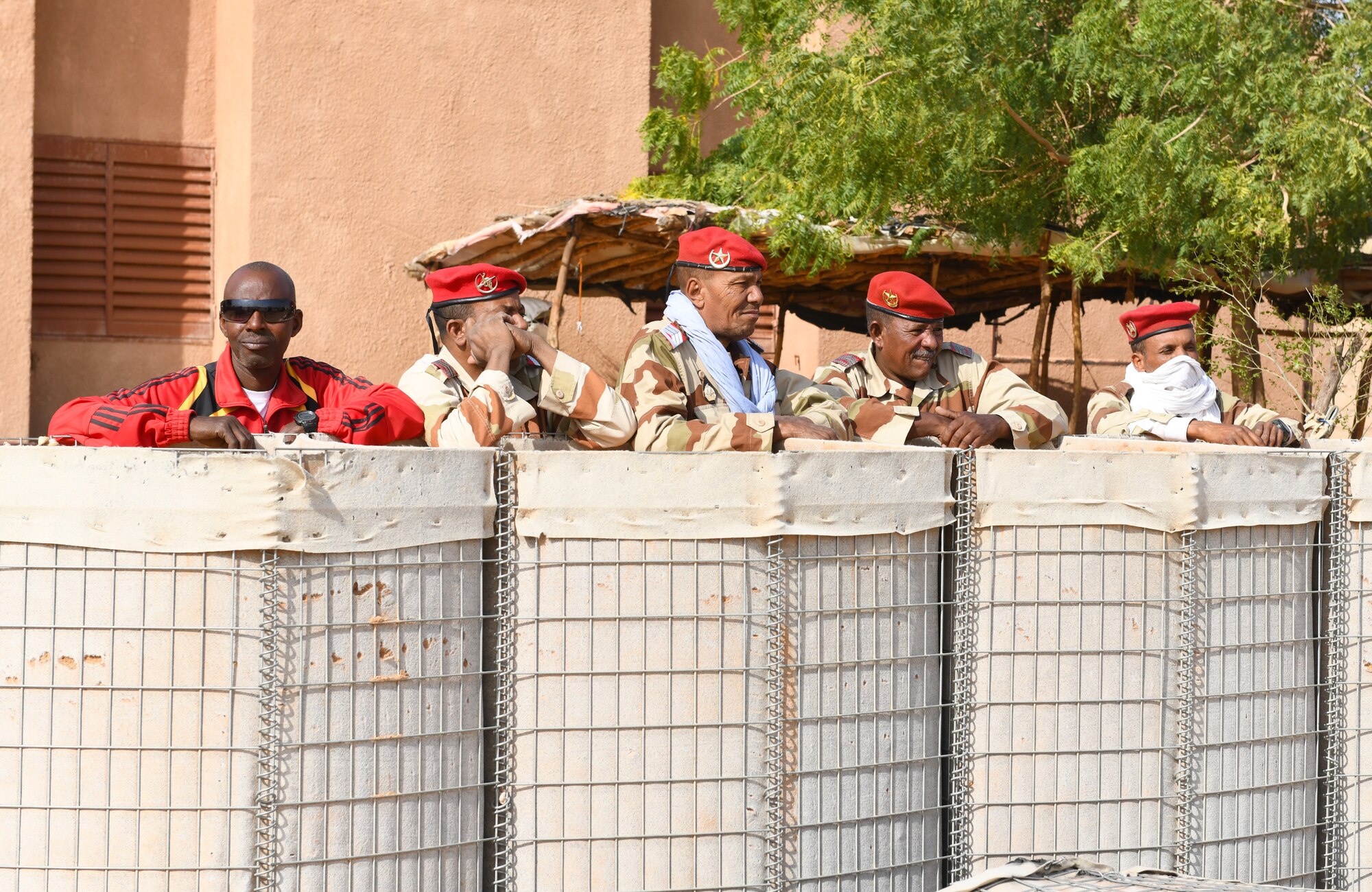 Photo of Airmen delivering protective barriers to help fortify a National Guard of Niger’s compound.
