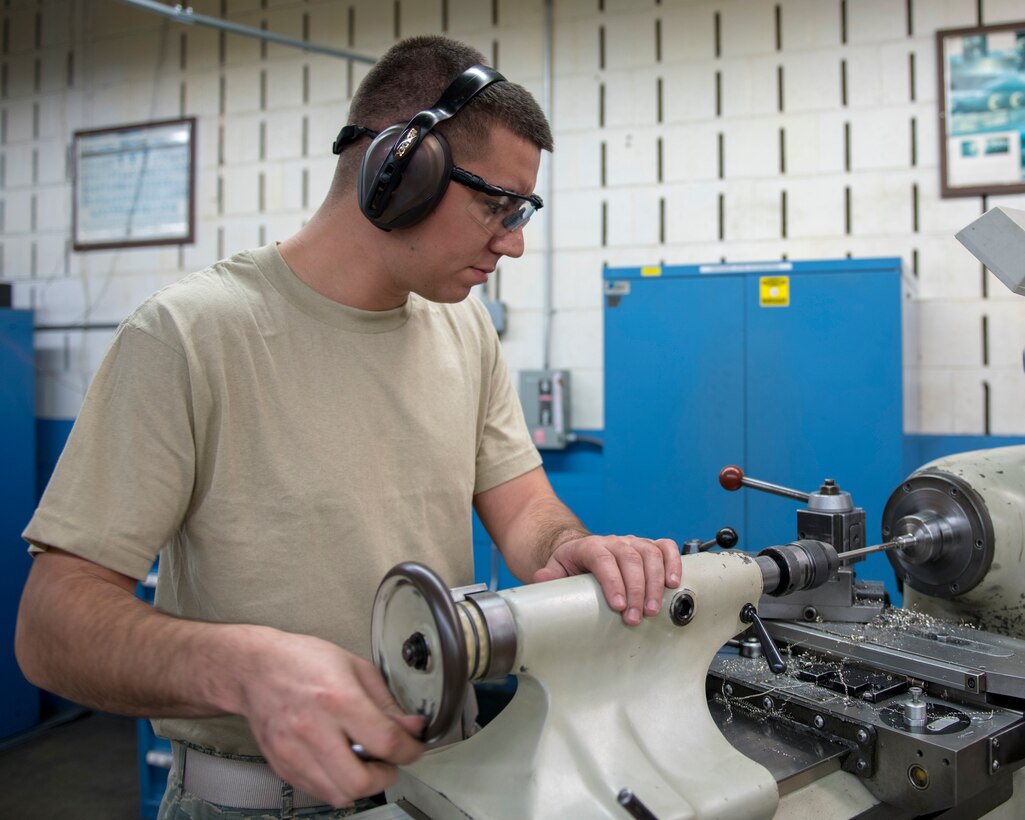 Airman 1st Class Arnoldo Madrigal, 4th Equipment Maintenance Squadron metals technology fabrication flight apprentice, uses a lathe to fabricate a bushing, Feb. 4, 2020, at Seymour Johnson Air Force Base, N.C.