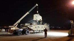 Soldiers of the 1107th Theater Aviation Sustainment Maintenance Group work to reassemble a CH-47 (Chinook) helicopter at Camp Buehring, Kuwait, Jan. 26, 2020. (Courtesy photo)