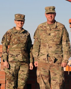 Indiana National Guard 1st Lt. Sara Holloway and Sgt. 1st Class Jacob Holloway at a base camp in the Middle East Jan. 25, 2020. The Holloways are deployed with two Indiana units, the 1313th Engineer Company and 38th Infantry Division, respectively, and they deployed in 2015 together supporting Operation Enduring Freedom.