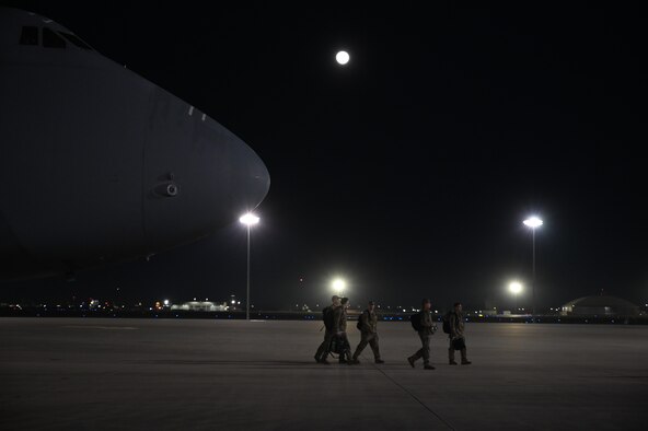 Airmen walk off flight line