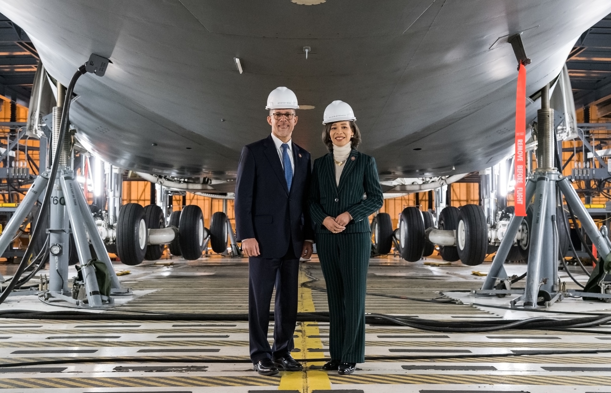 Rep. Anthony Brown of Maryland and Rep. Lisa Blunt Rochester of Delaware pose for a photo at the end of their C-5 Isochronal Inspection Dock tour Feb. 14, 2020, on Dover Air Force Base, Delaware. Brown and Blunt Rochester received an environmental briefing and learned about C-5 maintenance during their visit to Dover AFB. (U.S. Air Force photo by Roland Balik)