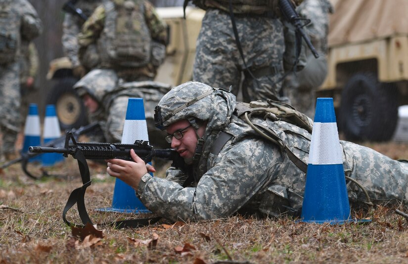 A U.S. Army Soldier assigned to the 53rd Movement Battalion settles into a fighting position during an area defense field training exercise at Joint Base Langley-Eustis, Virginia, Feb. 13, 2020.