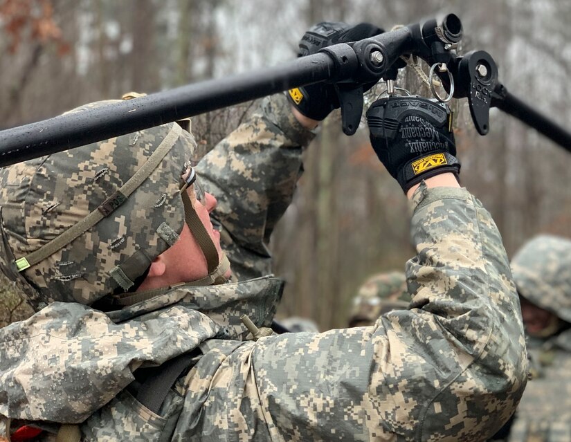 A U.S. Army Soldier secures a tent frame during an area defense field training exercise at Joint Base Langley-Eustis, Virginia, Feb. 13, 2020.