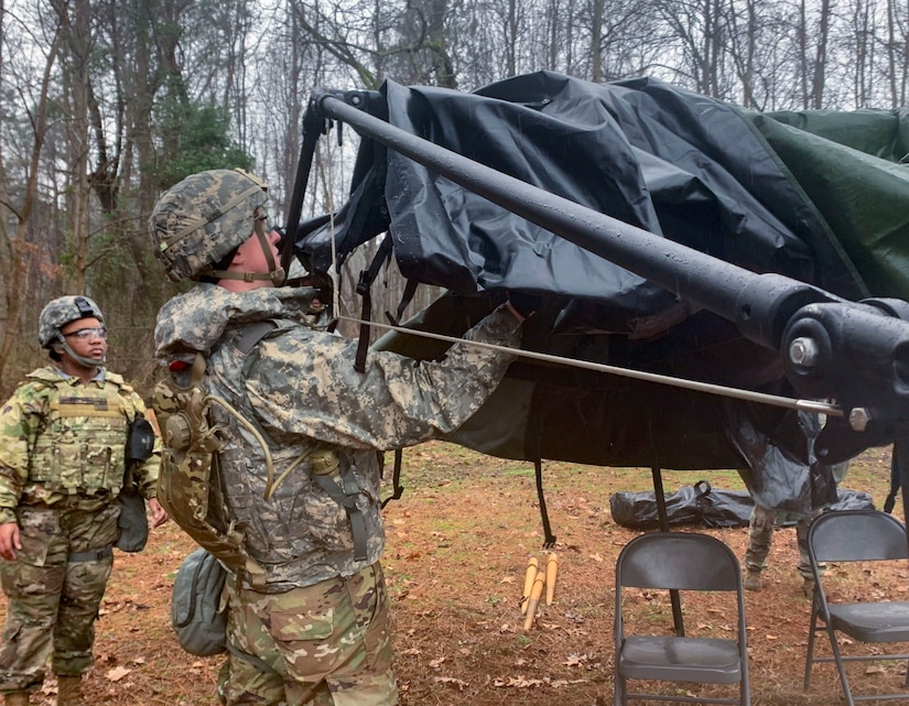 U.S. Army Soldiers assigned to the 53rd Movement Battalion set up a tent during an area defense field training exercise at Joint Base Langley-Eustis, Virginia, Feb. 13, 2020.