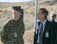 Col. Craig C. Clemans, commander, MCLB Barstow, speaks with retired Air Force Lt. Gen. Larry James, during a groundbreaking ceremony at the NASA/JPL Goldstone Deep Space Communications Complex aboard the National Training Center at Ft. Irwin, Feb. 11.