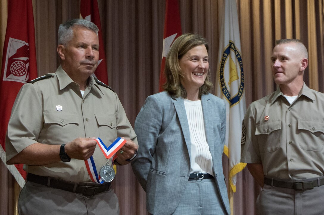Lt. Gen. Todd Semonite awards Tambour Eller the USACE Civilian of the Year Award.