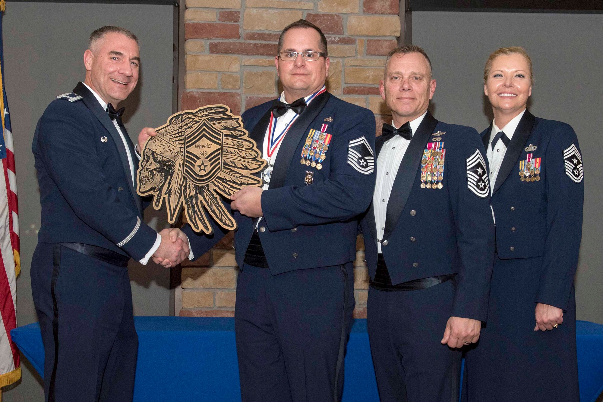 Senior Master Sgt. Max Wheeler, 49th Civil Engineer Squadron deputy fire chief, accepts a plaque during the Chief Recognition Ceremony, Feb. 15, 2020, on Holloman Air Force Base, N.M. Eight individuals from Team Holloman were recognized during the formal ceremony and dinner. (U.S. Air Force photo by Staff Sgt. Christine Groening)