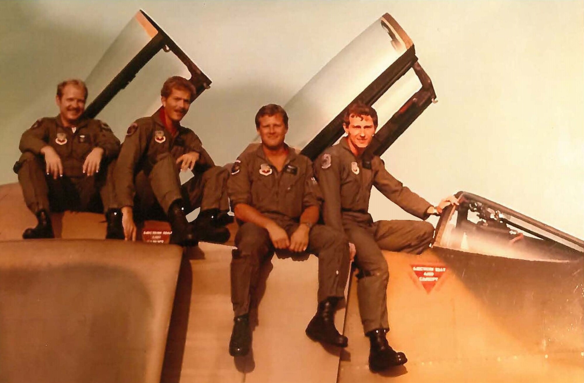 Staff Sgt. Jim Cagle, second from left, poses for a photo on a  F-4C Phantom at an undisclosed location. 26 years after separating from service at the rank of captain. Cagle rejoined as enlisted member with the 403rd Wing at Keesler Air Force Base, Miss. (U.S. Air Force courtesy photo)