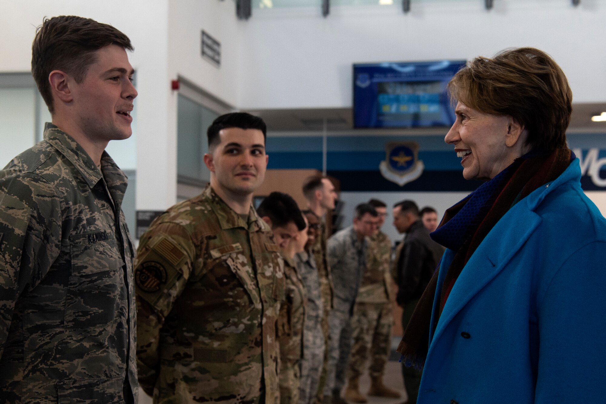 Secretary of the Air Force Barbara M. Barrett speaks with U.S. Air Force Airmen from the 52nd Fighter Wing in the passenger terminal at Spangdahlem Air Base, Germany, Feb. 15, 2020. Barrett coined multiple Airmen for their outstanding performance. (U.S. Air Force photo by Airman 1st Class Valerie Seelye)