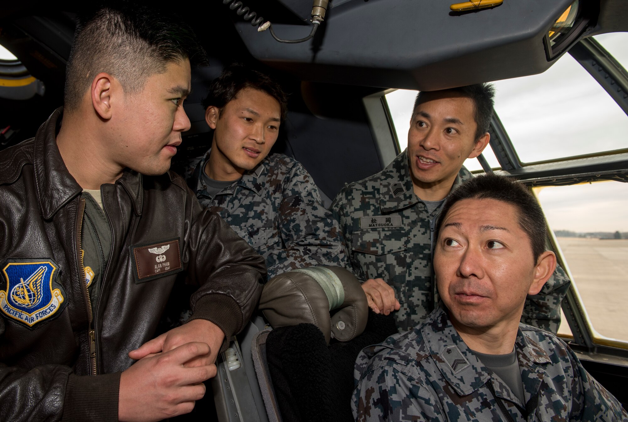 Capt. Alan Pham, 36th Airlift Squadron C-130J Super Hercules pilot, gives a C-130J brief to Japan Air Self-Defense Force members, assigned to the Iruma Air Base, during a tour at Yokota Air Base, Japan, Feb.12, 2020.