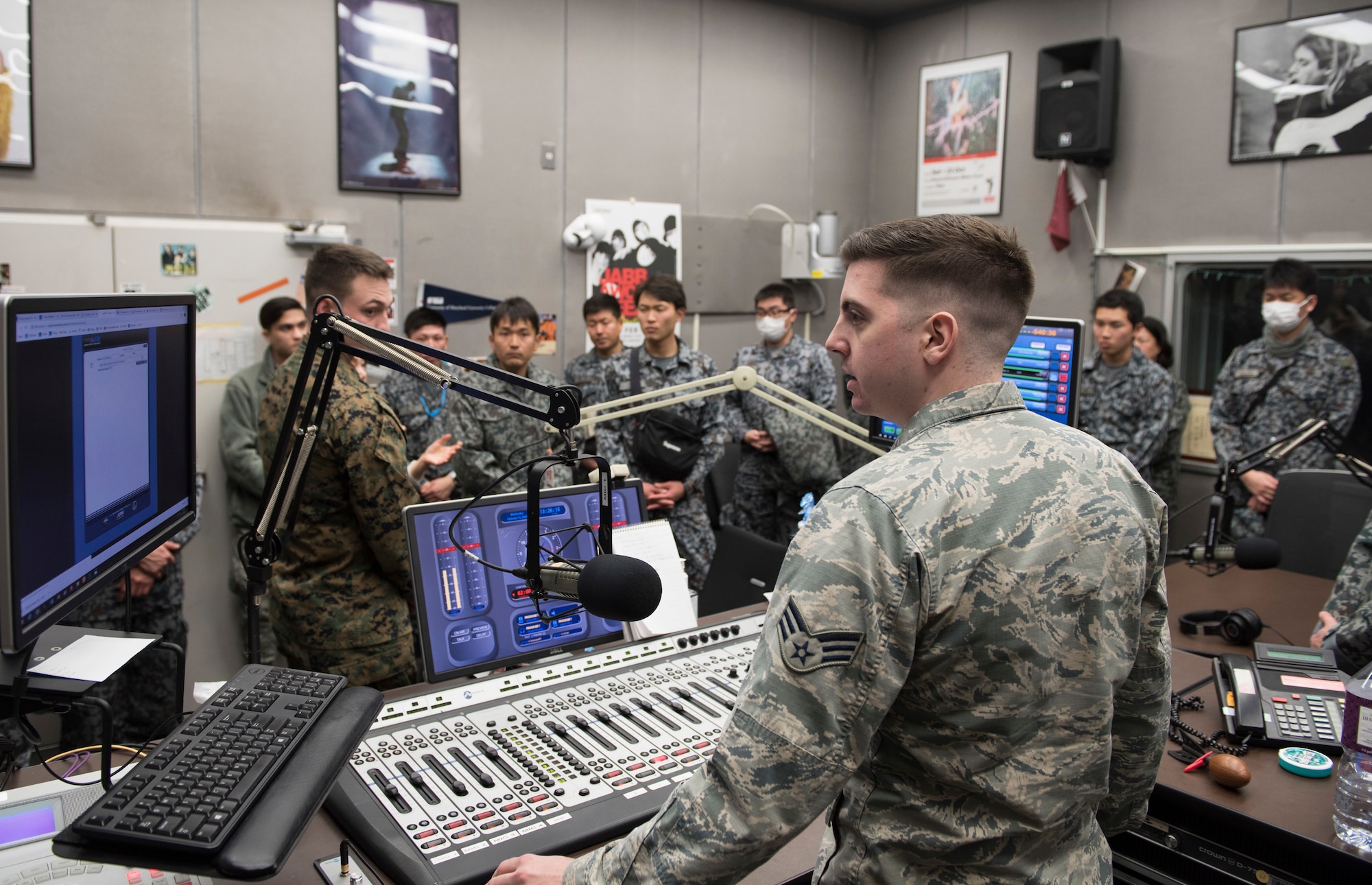 Japan Air Self-Defense Force members tour American Forces Network Tokyo during a tour at Yokota Air Base, Japan, Feb.12, 2020.