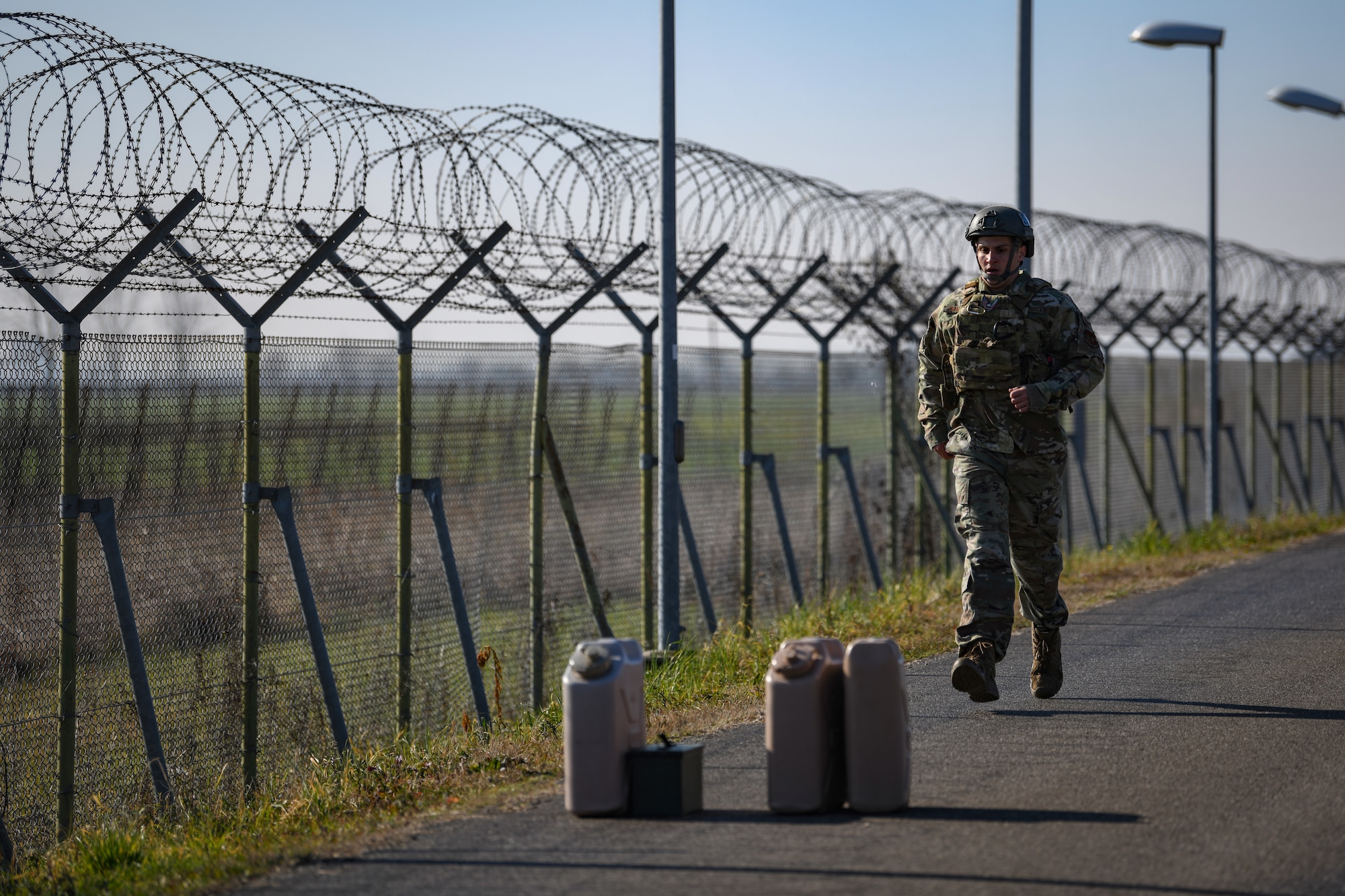 U.S. Air Force Senior Airman Dustin Samano, 31st Security Forces Squadron security response team leader, runs during a 400 meter equipment carry at Aviano Air Base, Italy, Feb. 14, 2020. Twenty-one SFS members participated in the 2020 Defender Challenge which demonstrated endurance, strength, resiliency and tenacity. (U.S. Air Force photo by Airman 1st Class Ericka A. Woolever)