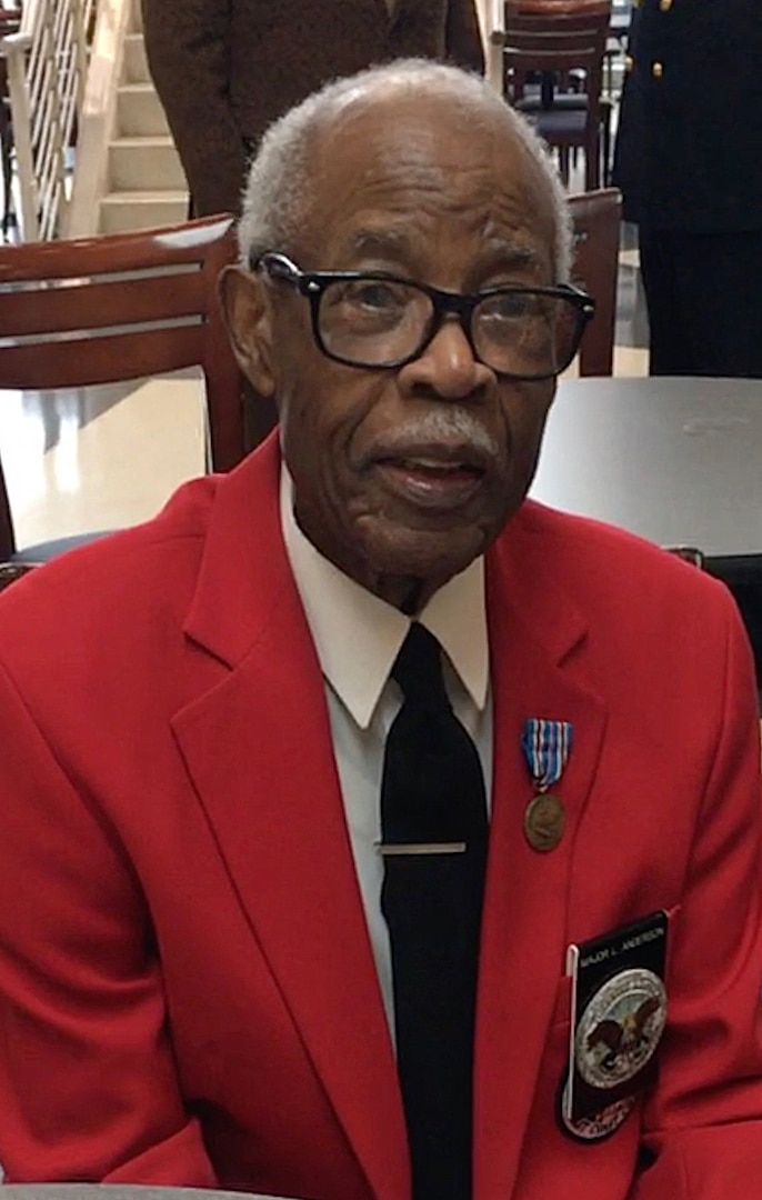 Black man in a red jacket