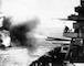 The battleship USS New York fires its 14-inch guns on Japanese encampments on Iwo Jima, Feb. 16, 1945, in preparation for the Marine landings.