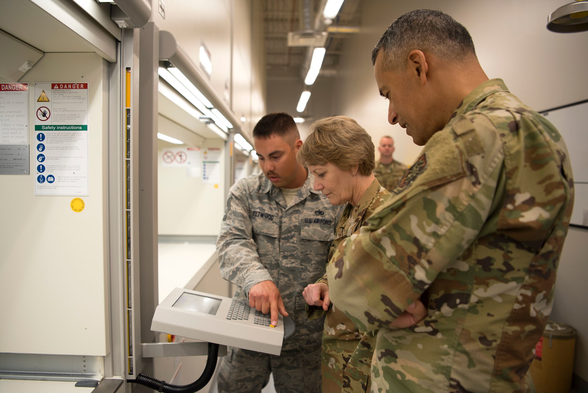 U.S. Air Force Gen. Maryanne Miller, Air Mobility Command commander, and Chief Master Sgt. Terrence Greene, AMC command chief, are shown the new vertical lift storage system at MacDill Air Force Base, Fla., Feb. 13, 2020. This streamline tool kit system was recently implemented as part of the wing’s “Fuel Tank” program, which gives Airmen the opportunity to present innovative ideas to leadership.